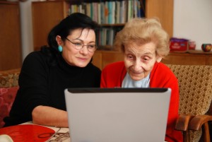Elderly relative and daughter reviewing care homes